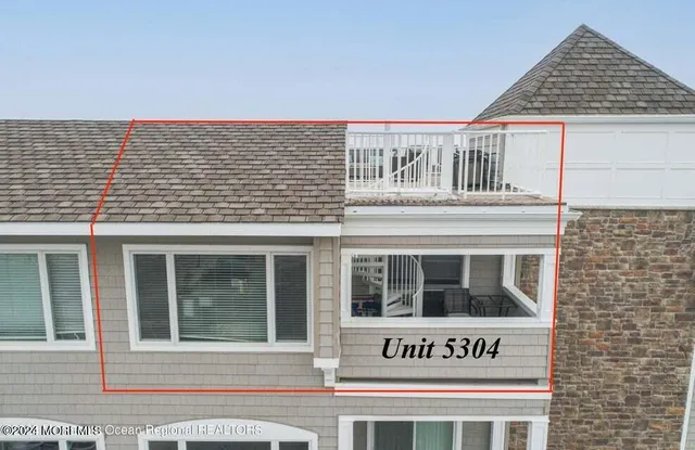 a view of a house with large windows