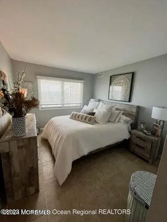 a room with furniture and kitchen view