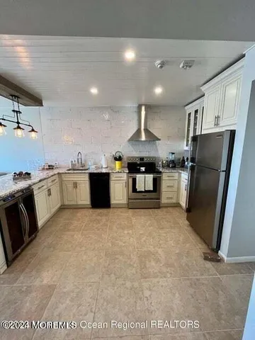 a bedroom with a bed couch and window