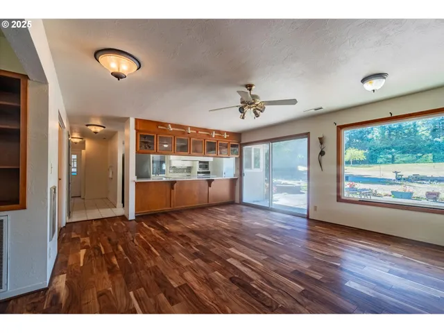 a kitchen with stainless steel appliances a stove a sink and a refrigerator