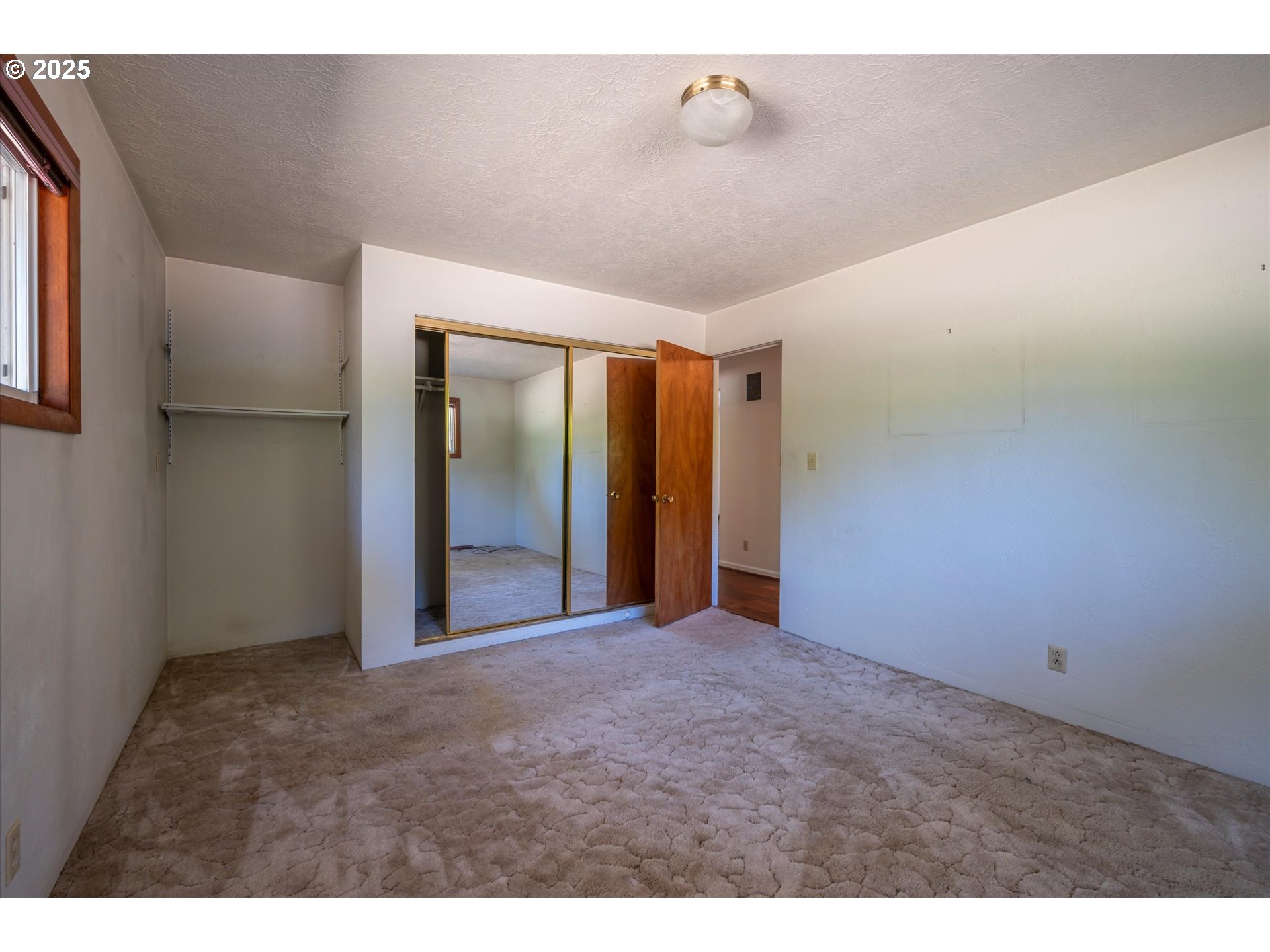 56060 Wheeler Road Bandon, OR 97411 - Photo 20 of 43 a view of an empty room