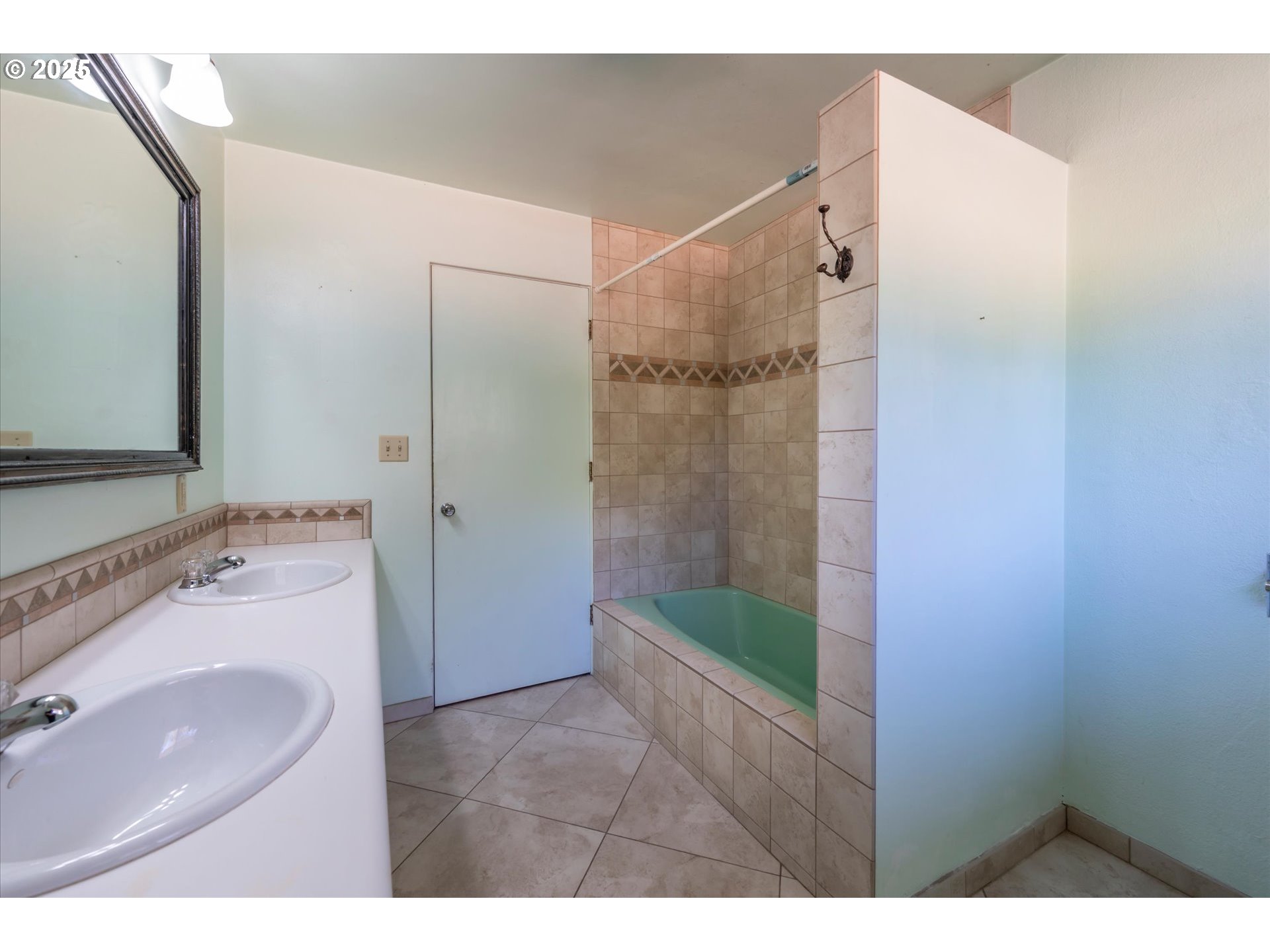 56060 Wheeler Road Bandon, OR 97411 - Photo 22 of 43 a bathroom with a sink and a mirror