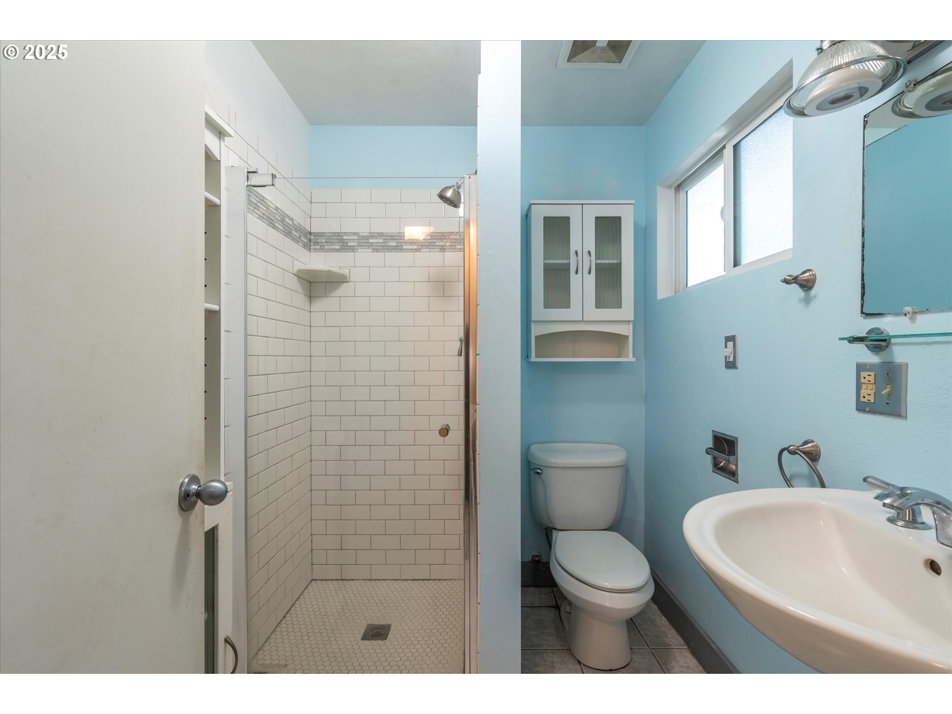 56060 Wheeler Road Bandon, OR 97411 - Photo 23 of 43 a bathroom with a toilet sink and shower