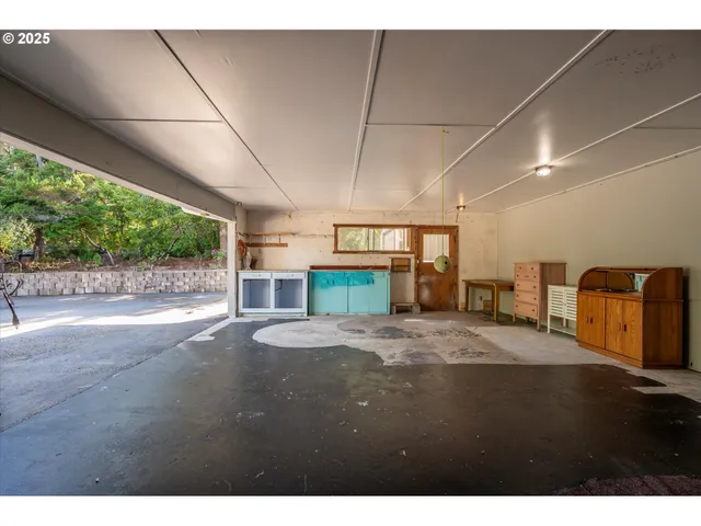 a view of a field with grass and trees