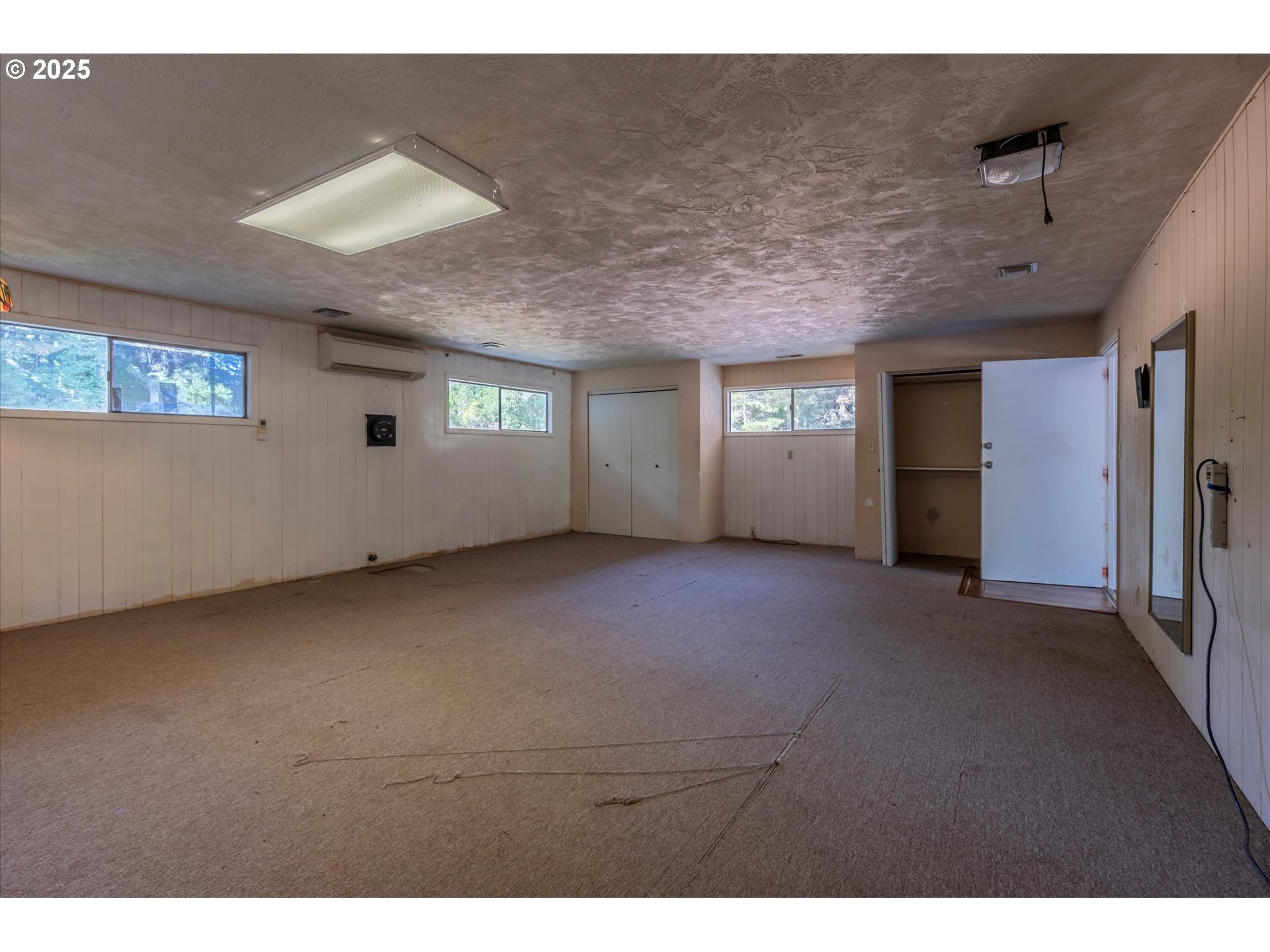 56060 Wheeler Road Bandon, OR 97411 - Photo 27 of 43 a view of empty room with windows