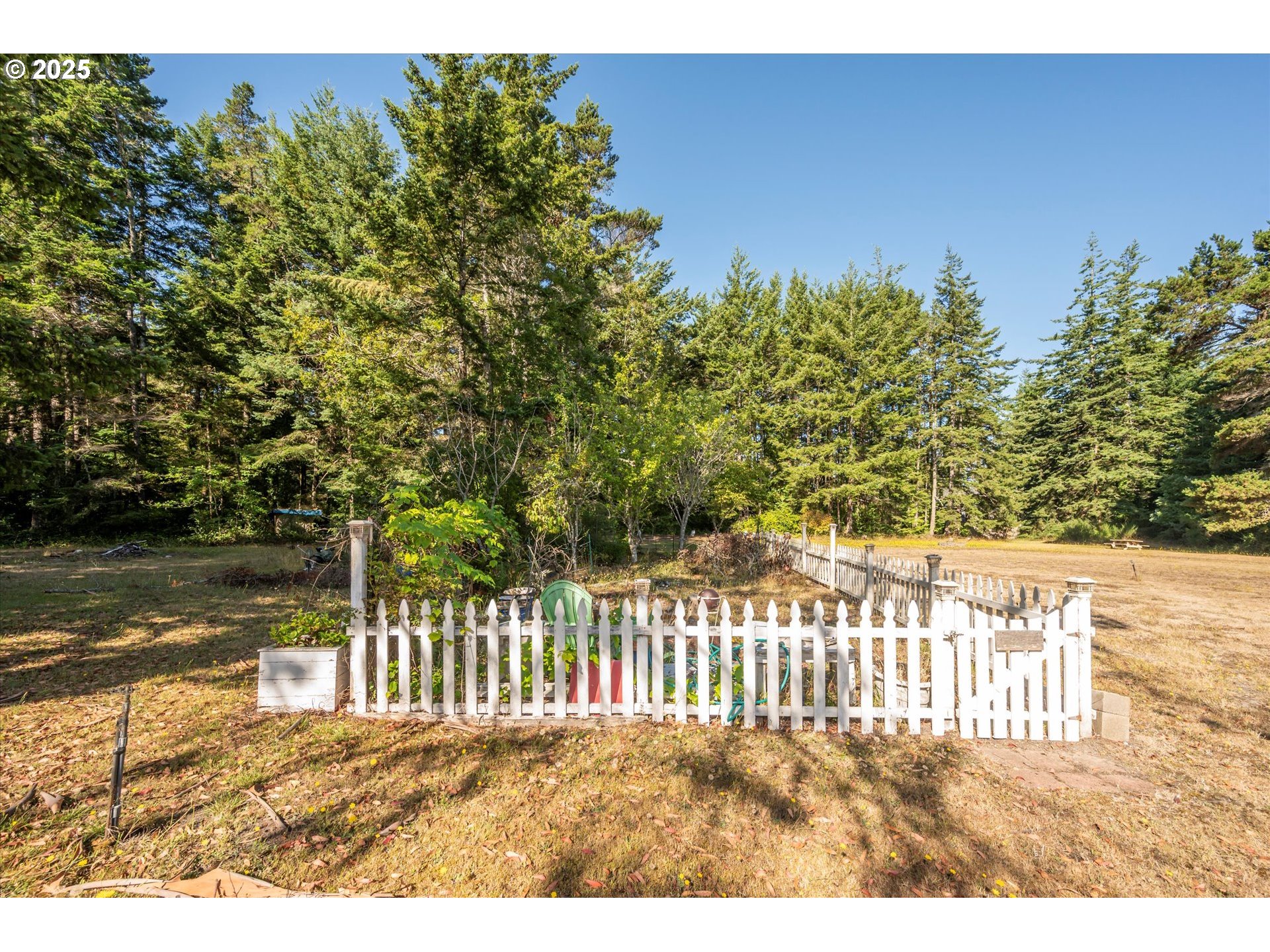 56060 Wheeler Road Bandon, OR 97411 - Photo 32 of 43 a view of a wooden fence