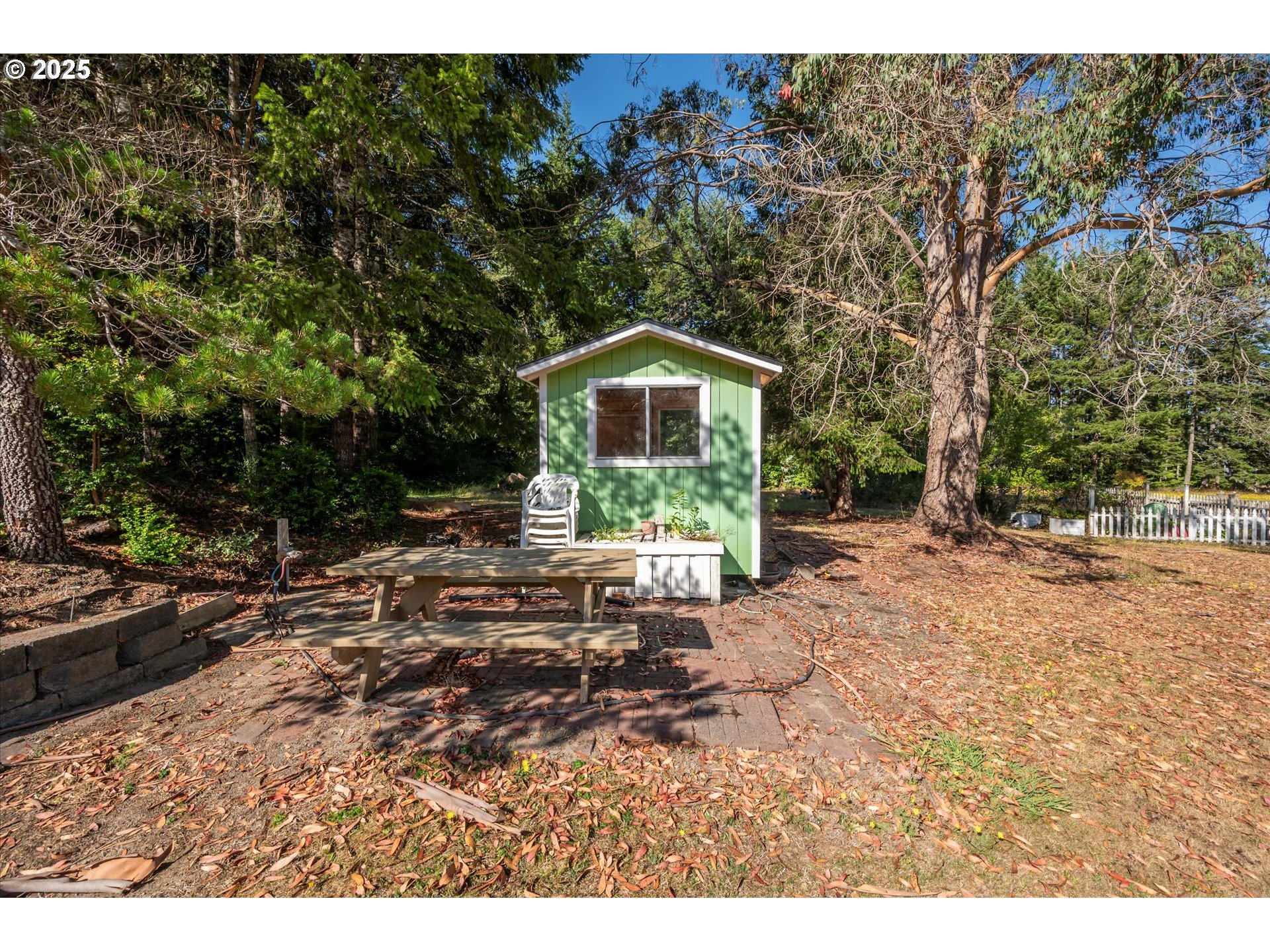 56060 Wheeler Road Bandon, OR 97411 - Photo 33 of 43 a view of a house with a yard