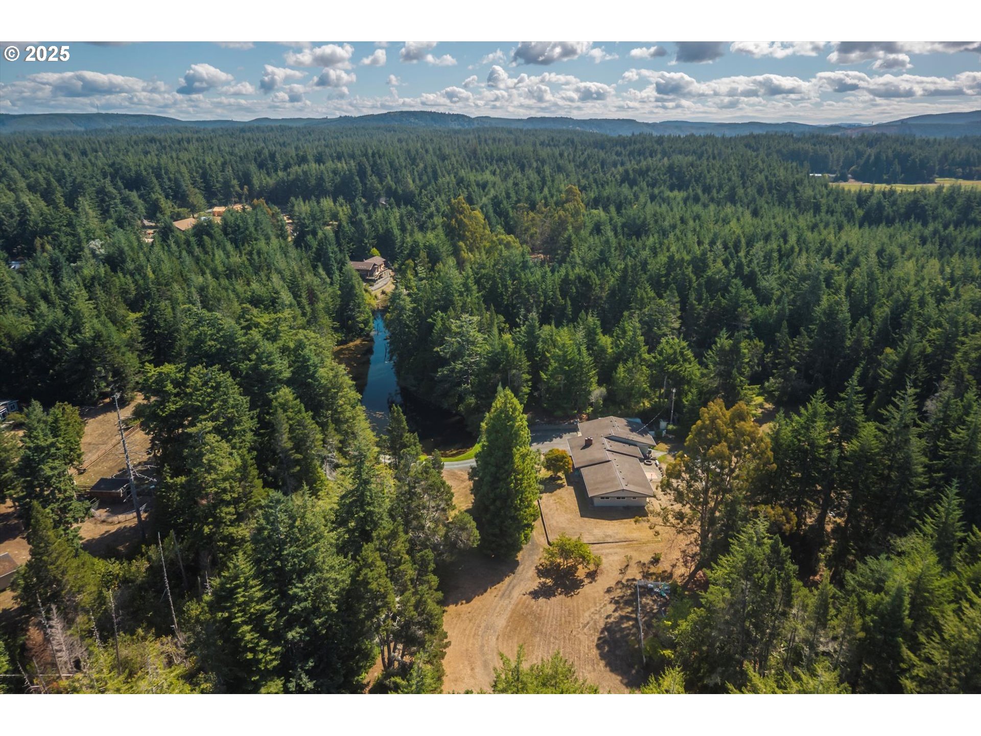 56060 Wheeler Road Bandon, OR 97411 - Photo 40 of 43 a view of outdoor space and mountain view