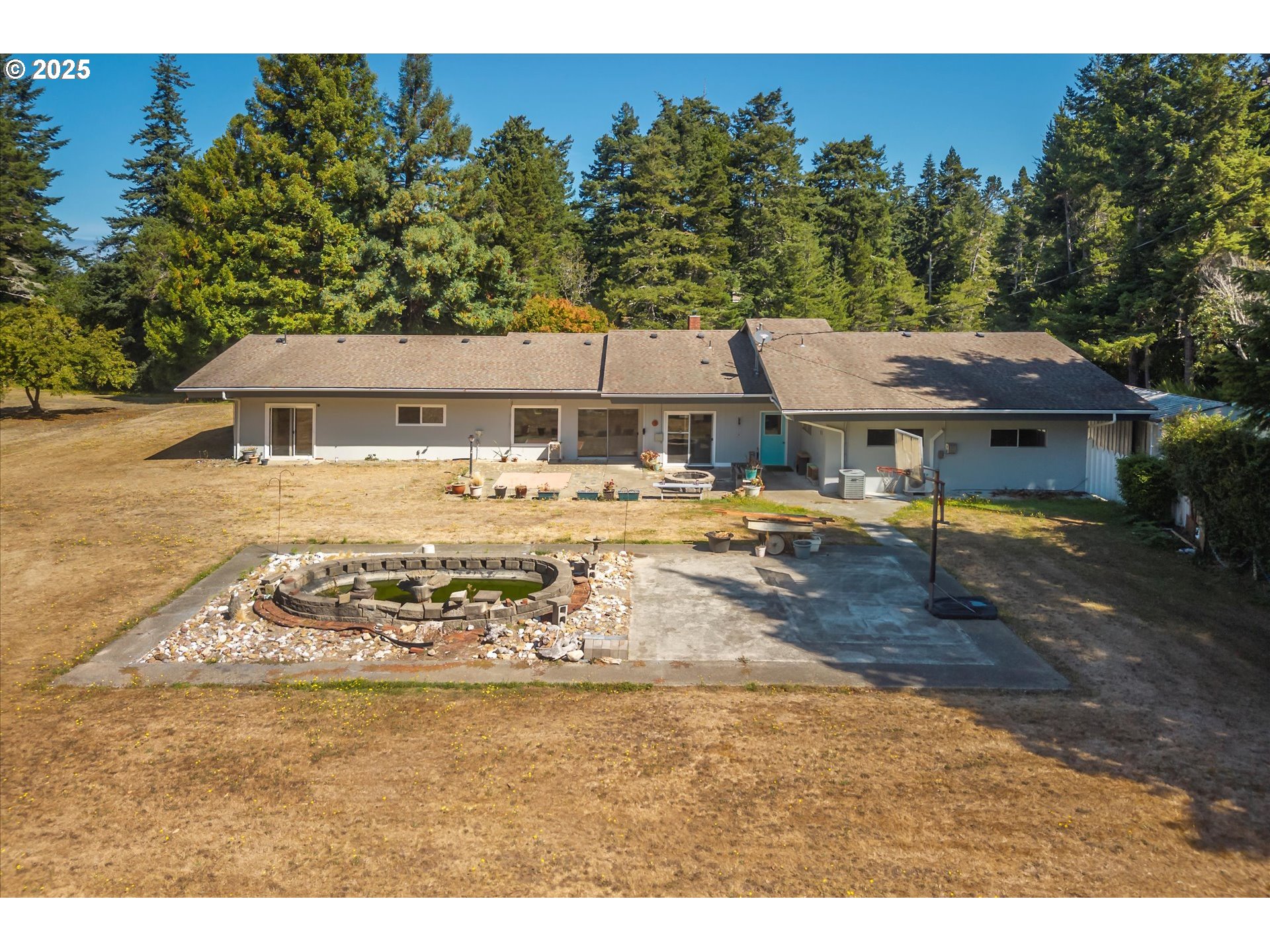 56060 Wheeler Road Bandon, OR 97411 - Photo 6 of 43 a view of outdoor space yard and lake