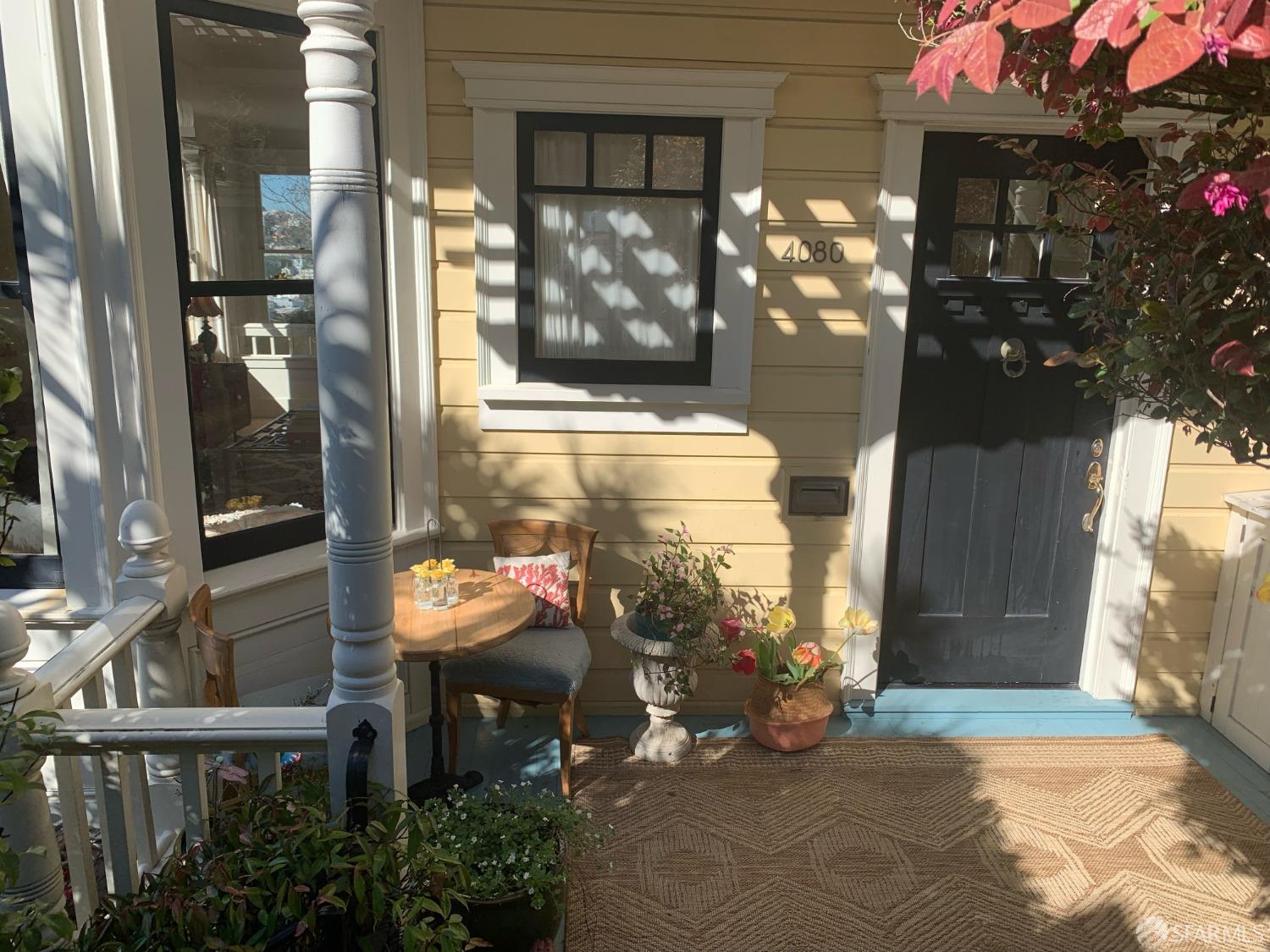 20th Street San Francisco, CA 94114 - Photo 3 of 6 a view of a porch with a table and chairs and potted plants