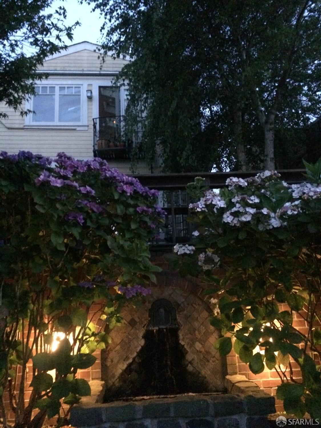 20th Street San Francisco, CA 94114 - Photo 5 of 6 a front view of a house with a yard and tree s