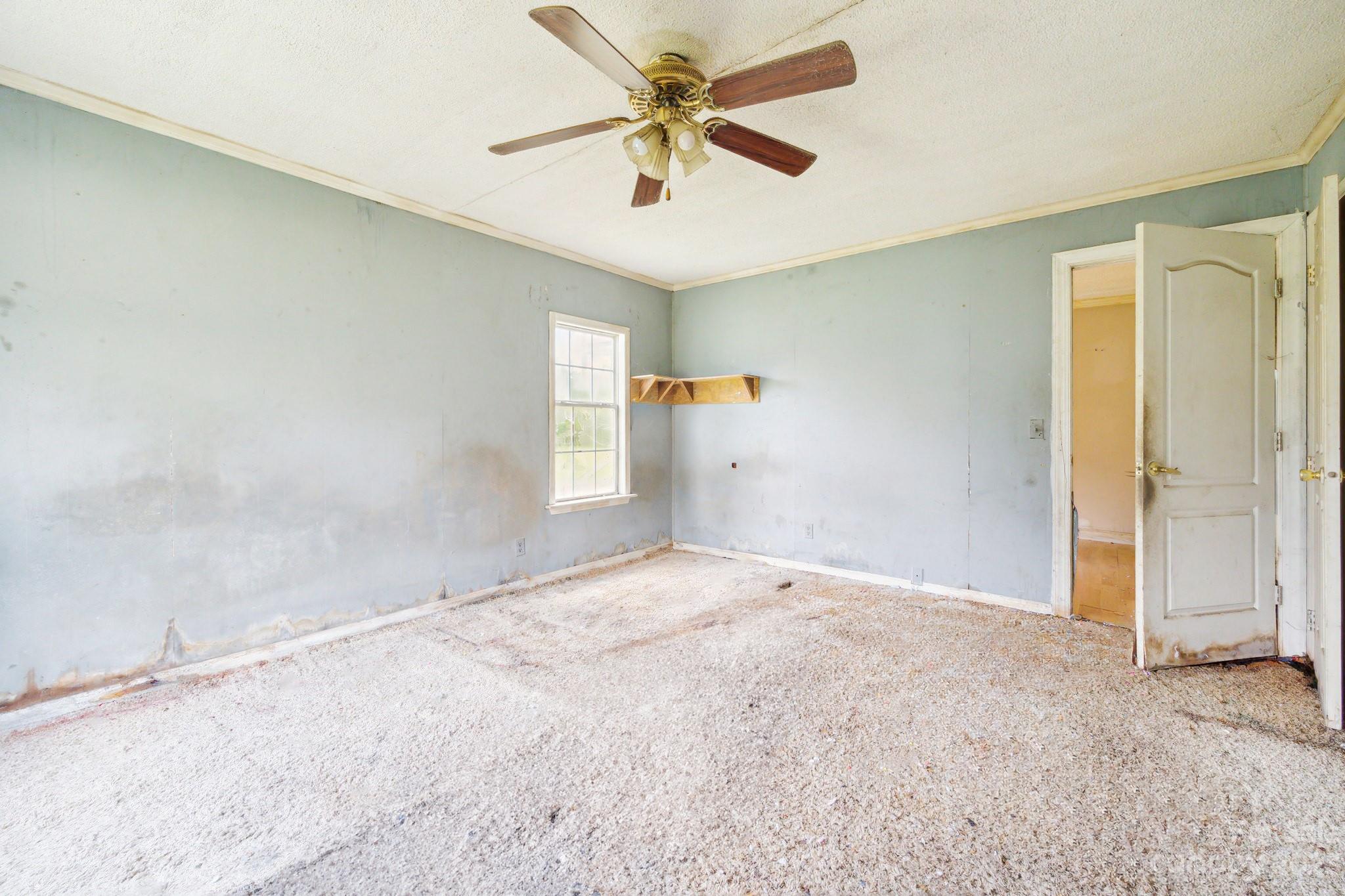 520 Wright Road Vass, NC 28394 - Photo 13 of 23 a view of a livingroom with a ceiling fan and window