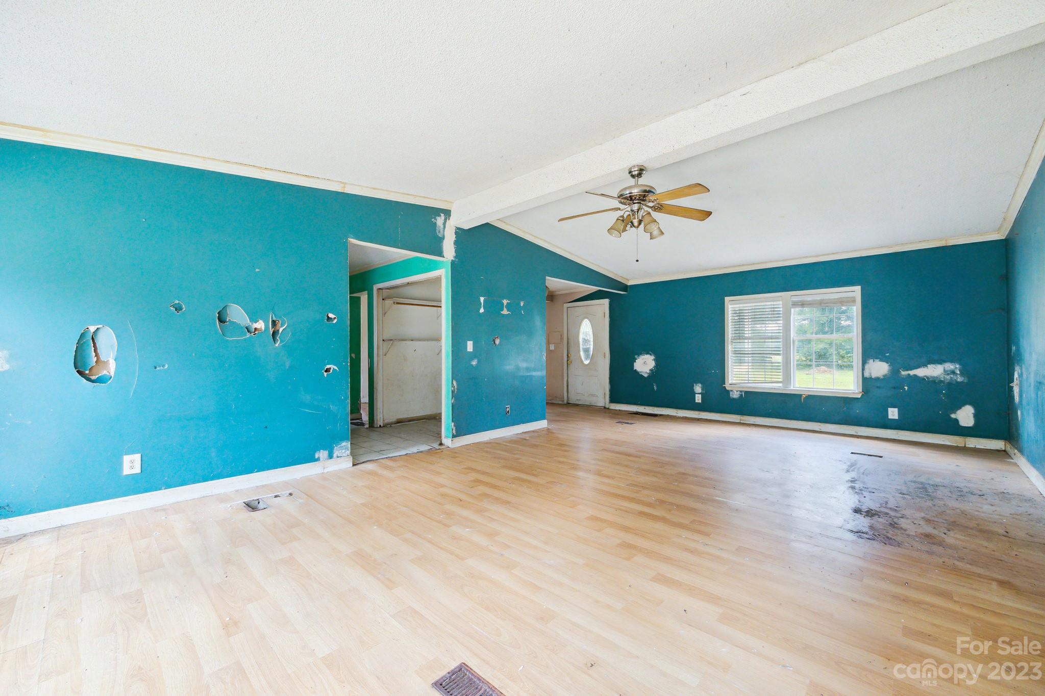 520 Wright Road Vass, NC 28394 - Photo 5 of 23 a view of a livingroom with a ceiling fan and window