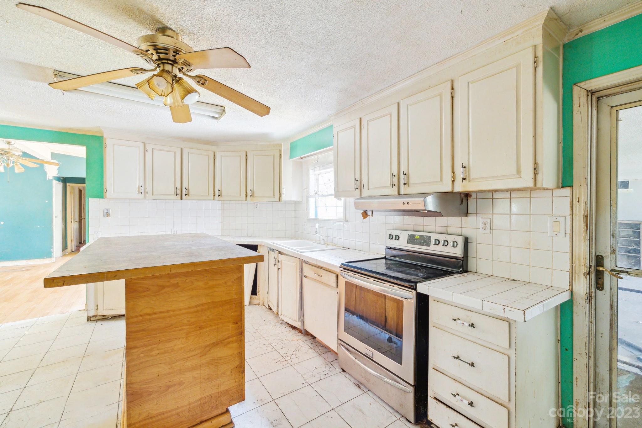 520 Wright Road Vass, NC 28394 - Photo 8 of 23 a kitchen with stainless steel appliances granite countertop a sink and cabinets