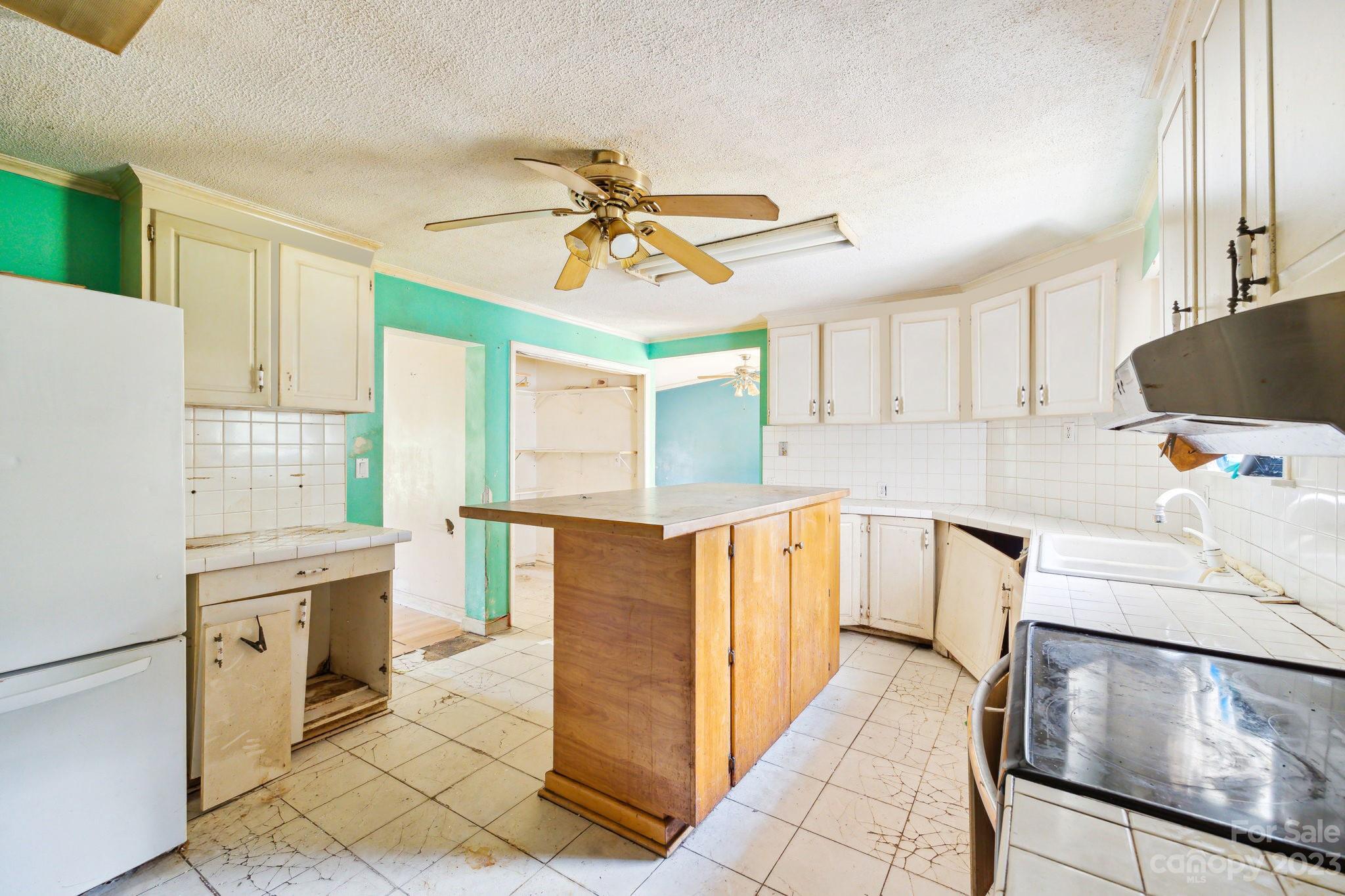 520 Wright Road Vass, NC 28394 - Photo 9 of 23 a kitchen with stainless steel appliances a stove a sink and a refrigerator