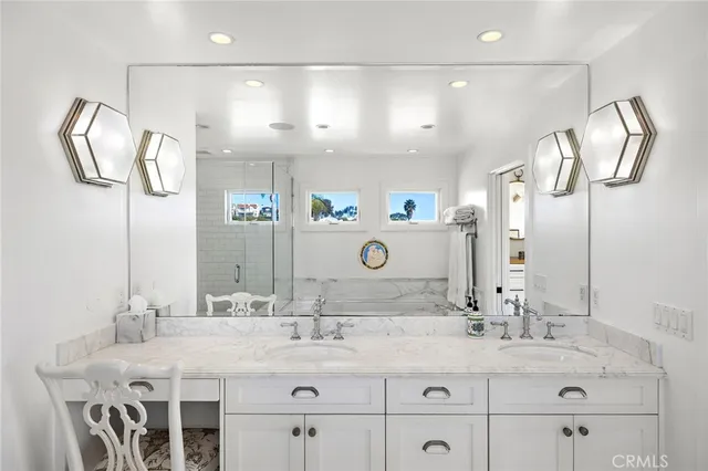 a bathroom with a double vanity sink and a mirror