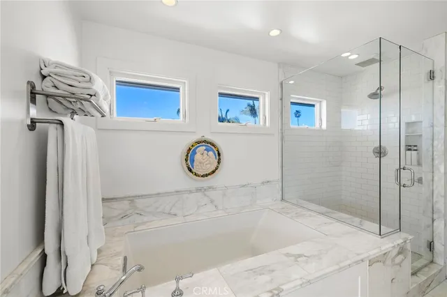 a bathroom with a tub and a shower