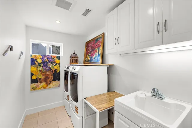 an aerial view of a house with a yard and potted plants