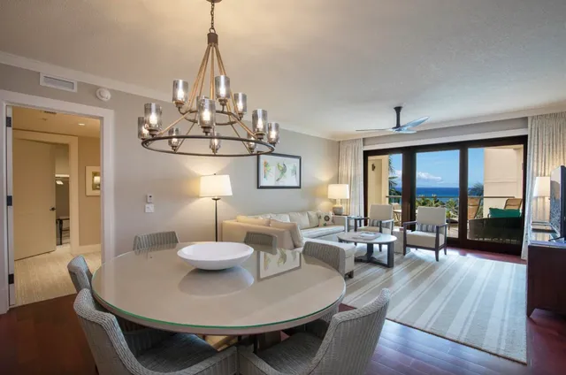 a view of a dining room with furniture wooden floor and chandelier
