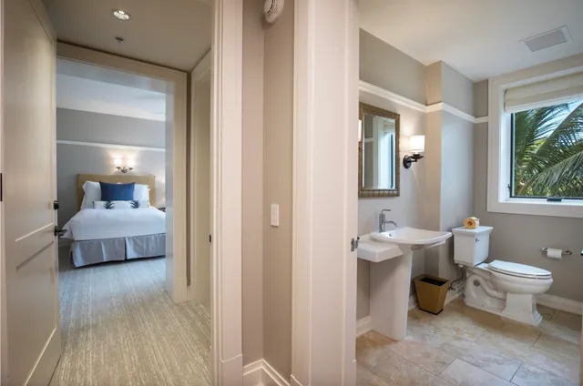 a kitchen with stainless steel appliances granite countertop a sink refrigerator stove and microwave