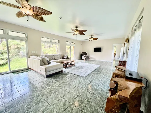 a spacious bedroom with a large bed and a window