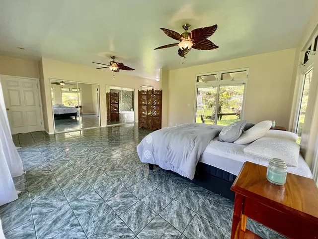 a bed room with a bed and a chandelier