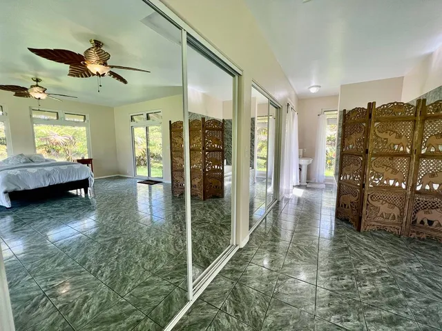 a bathroom with a tub a sink and a shower