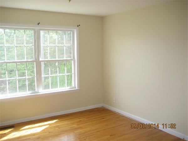 918 Jefferson Street Fall River, MA 02721 - Photo 4 of 6 a view of empty room with window