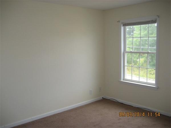 918 Jefferson Street Fall River, MA 02721 - Photo 6 of 6 an empty room with a window