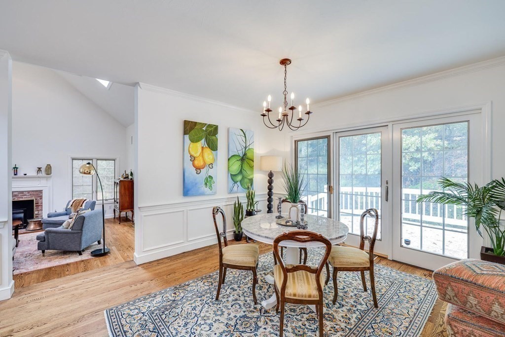 121 Beech Leaf Island Road Centerville, MA 02632 - Photo 16 of 42 a view of a dining room with furniture a rug and wooden floor