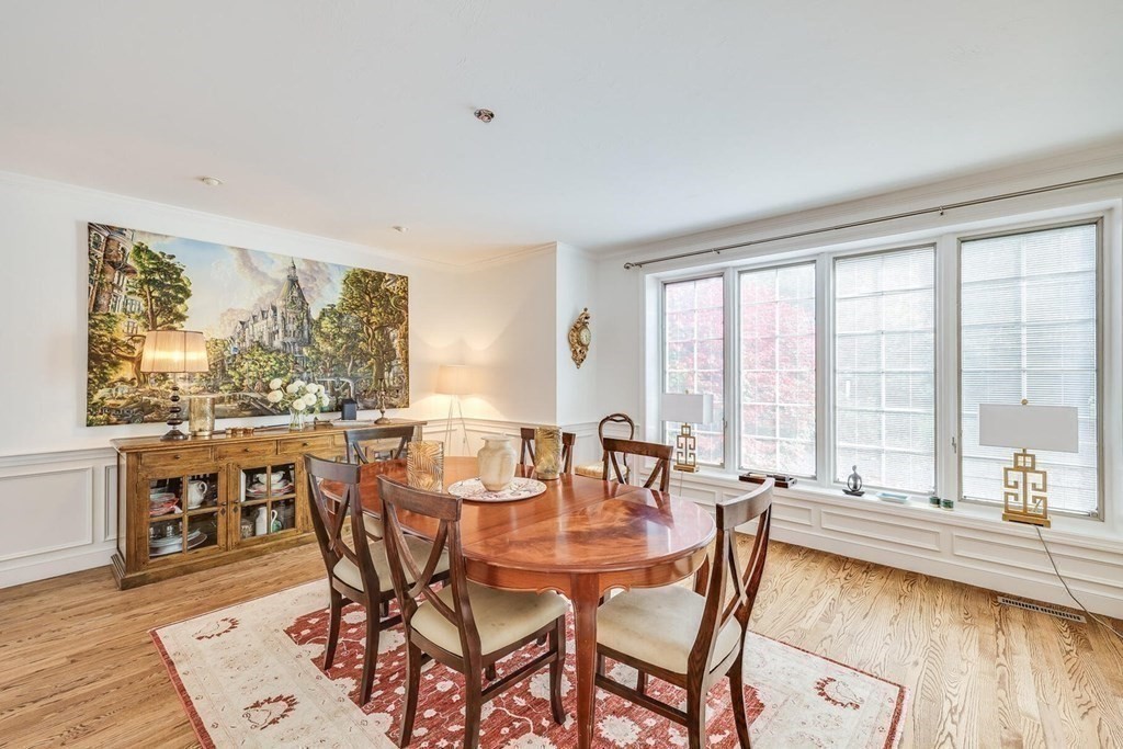 121 Beech Leaf Island Road Centerville, MA 02632 - Photo 26 of 42 a dining room with furniture large windows and wooden floor