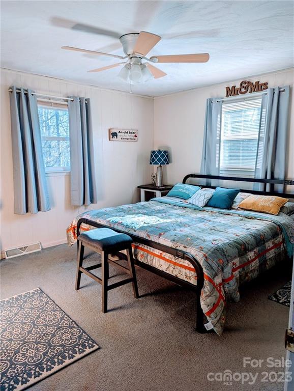 1180 Guy Road Hickory, NC 28602 - Photo 23 of 30 a bedroom with a bed a window and dresser