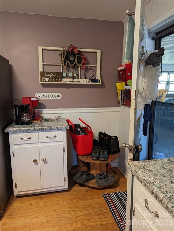 1180 Guy Road Hickory, NC 28602 - Photo 24 of 30 a living room with kitchen island and wooden floor