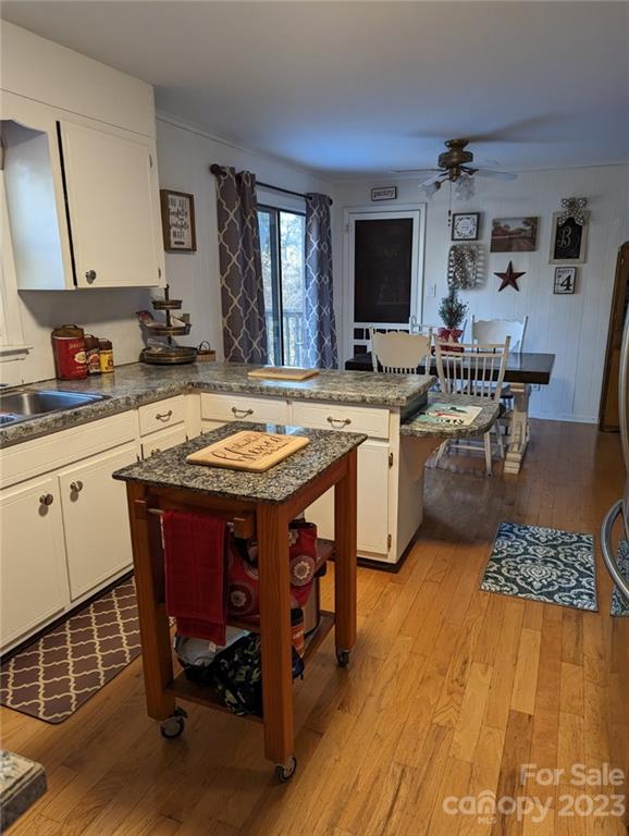 1180 Guy Road Hickory, NC 28602 - Photo 26 of 30 a large kitchen with kitchen island a sink table and chairs