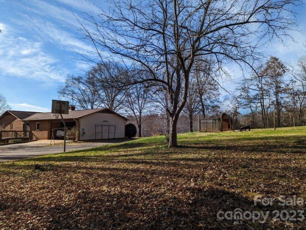 1180 Guy Road Hickory, NC 28602 - Photo 30 of 30 a big house with a big yard and large trees