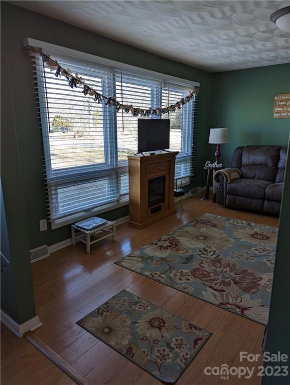 1180 Guy Road Hickory, NC 28602 - Photo 4 of 30 a living room with furniture and a flat screen tv