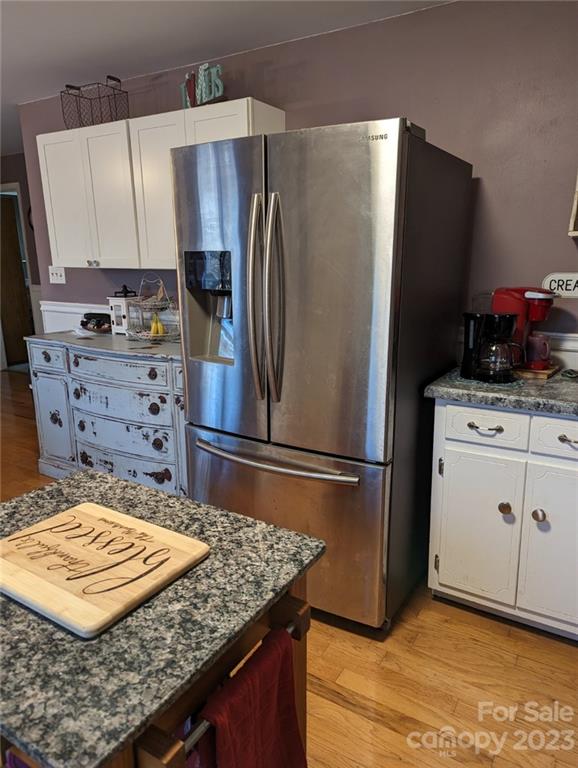 1180 Guy Road Hickory, NC 28602 - Photo 6 of 30 a kitchen with refrigerator and cabinets