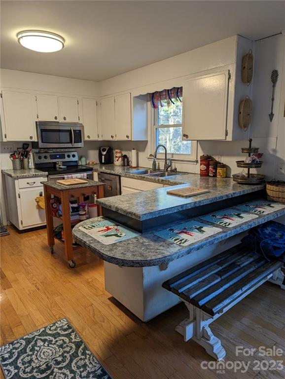 1180 Guy Road Hickory, NC 28602 - Photo 7 of 30 a kitchen with sink a stove and cabinets