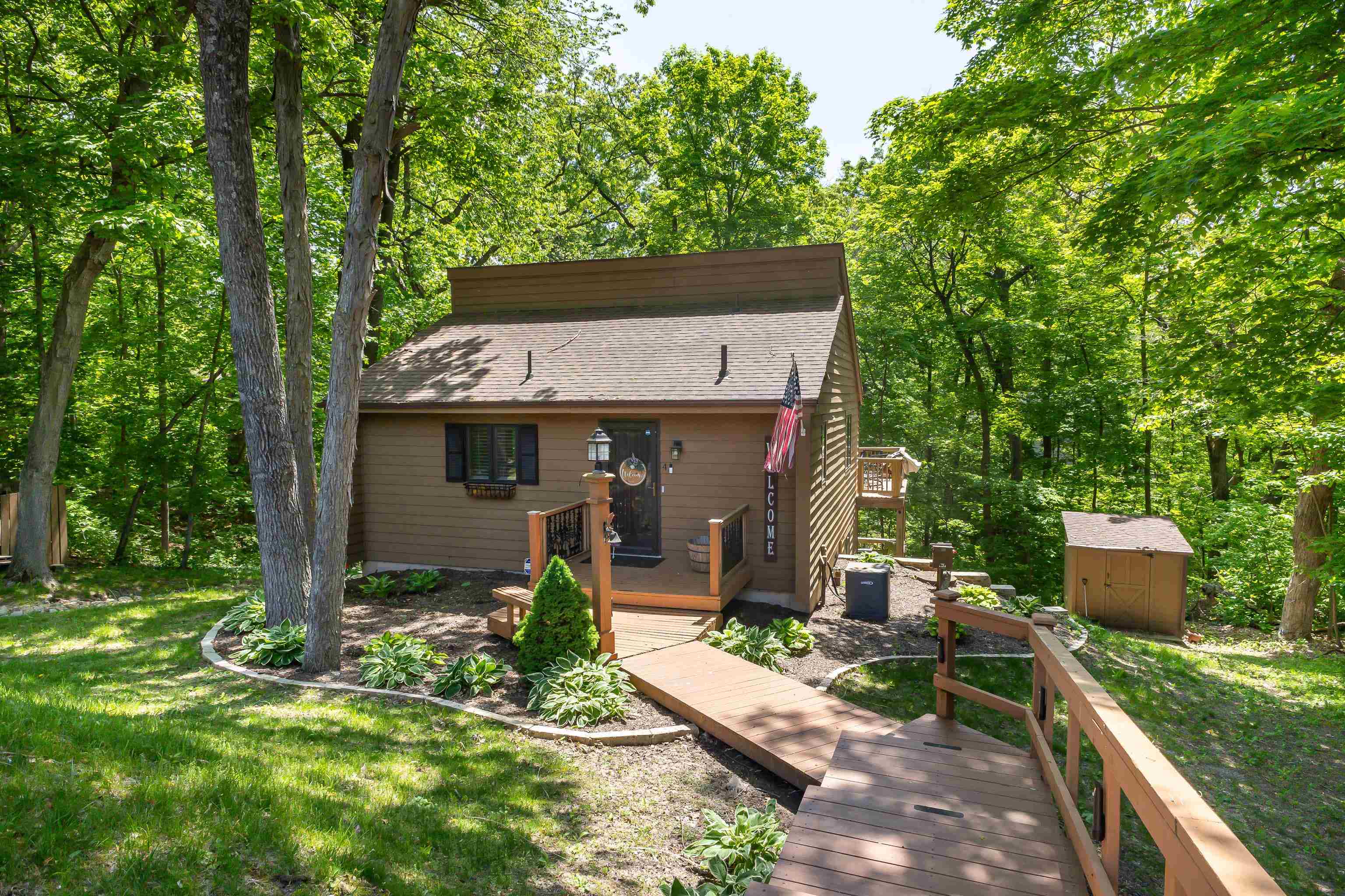 4 Colony Court Galena, IL 61036 - Photo 13 of 32 a view of house with backyard outdoor seating and green space