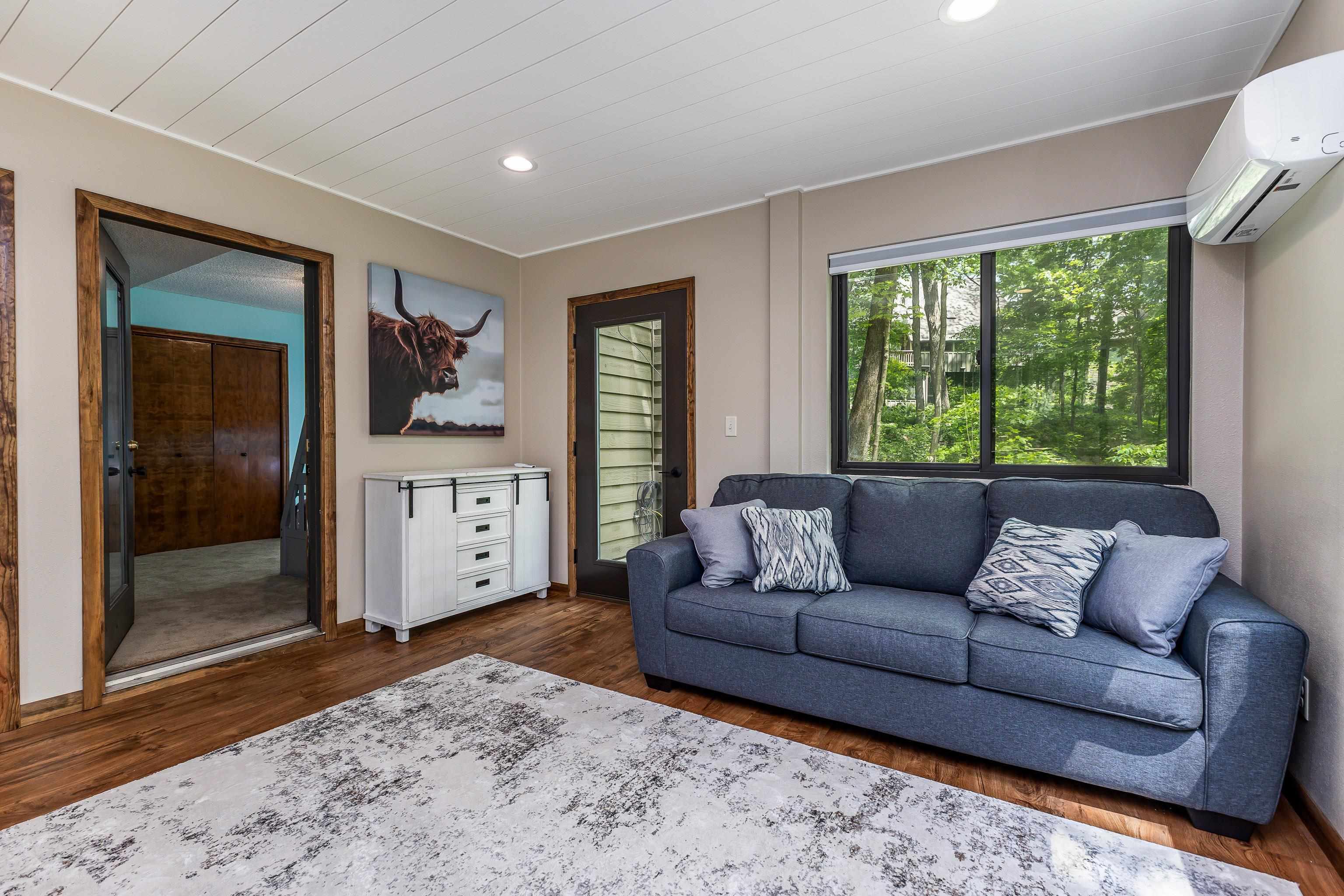 4 Colony Court Galena, IL 61036 - Photo 27 of 32 a living room with furniture and a large window