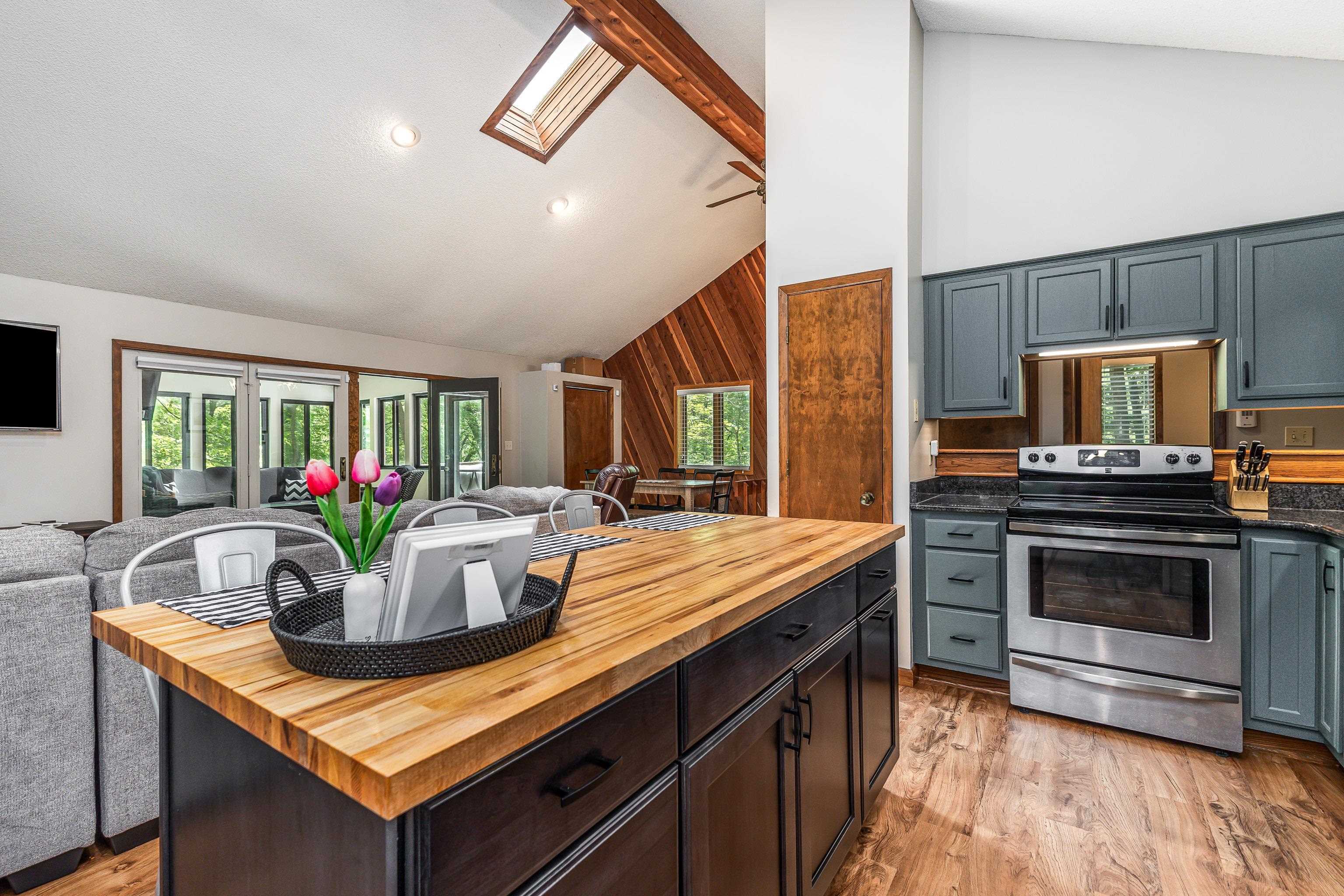 4 Colony Court Galena, IL 61036 - Photo 3 of 32 a kitchen with a stove and a white cabinets