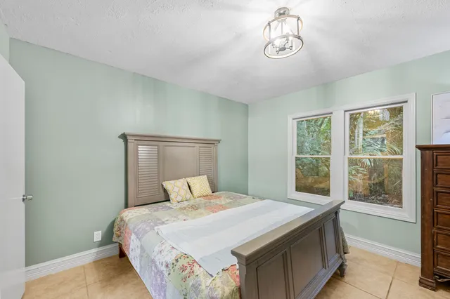 a bathroom with a sink mirror and toilet