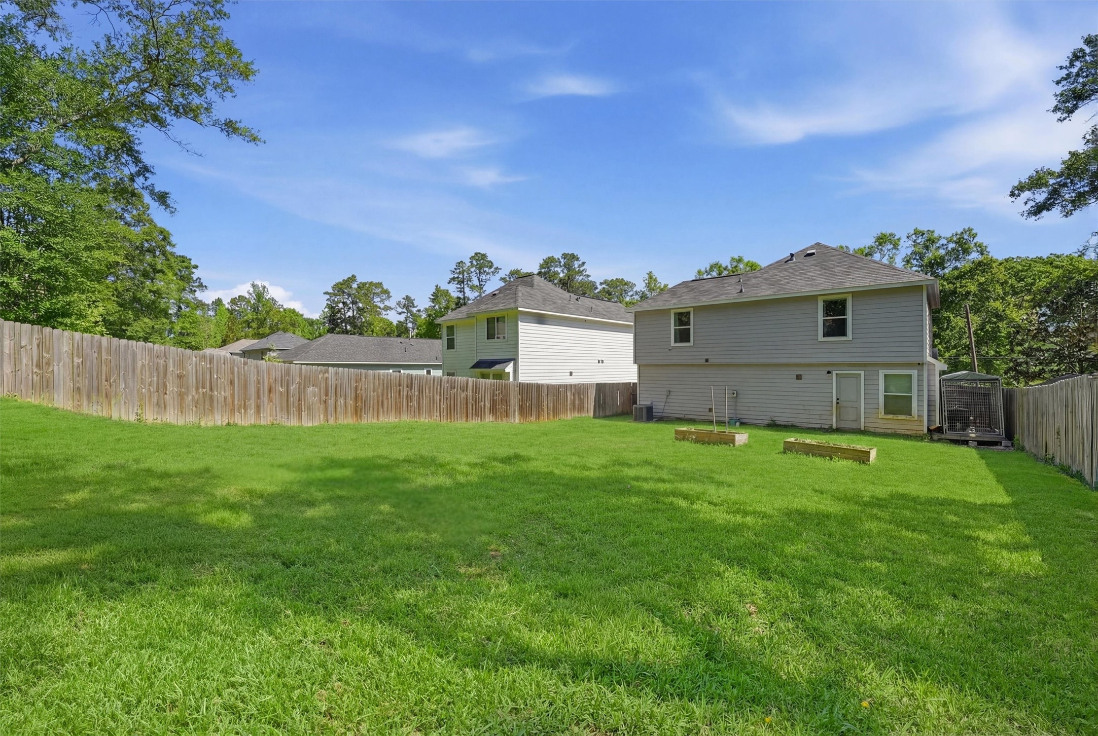 15011 Crockett Road Willis, TX 77378 - Photo 20 of 24 Generous backyard with endless outdoor potential.