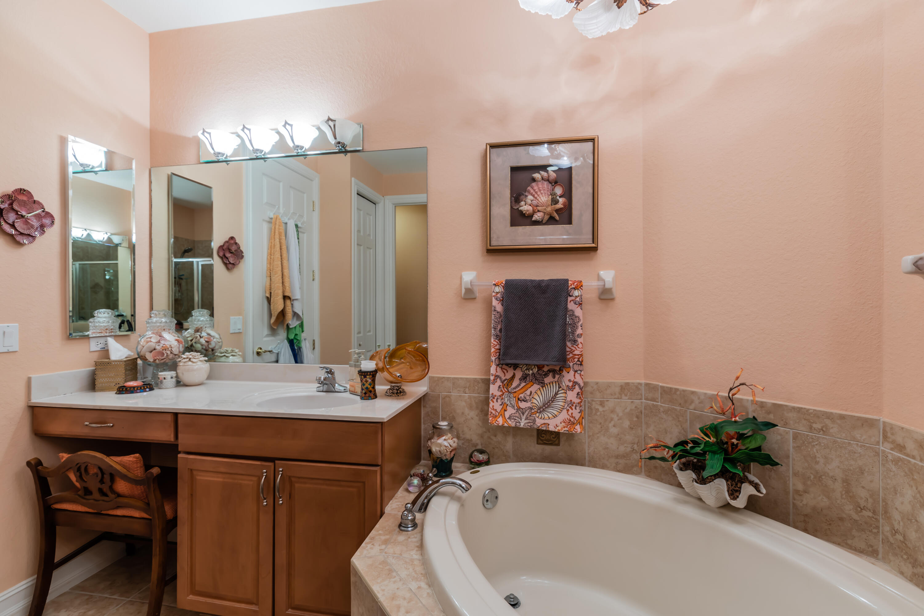 14728 Cranberry Naples Naples, FL 34114 - Photo 12 of 26 a bathroom with a sink and a mirror