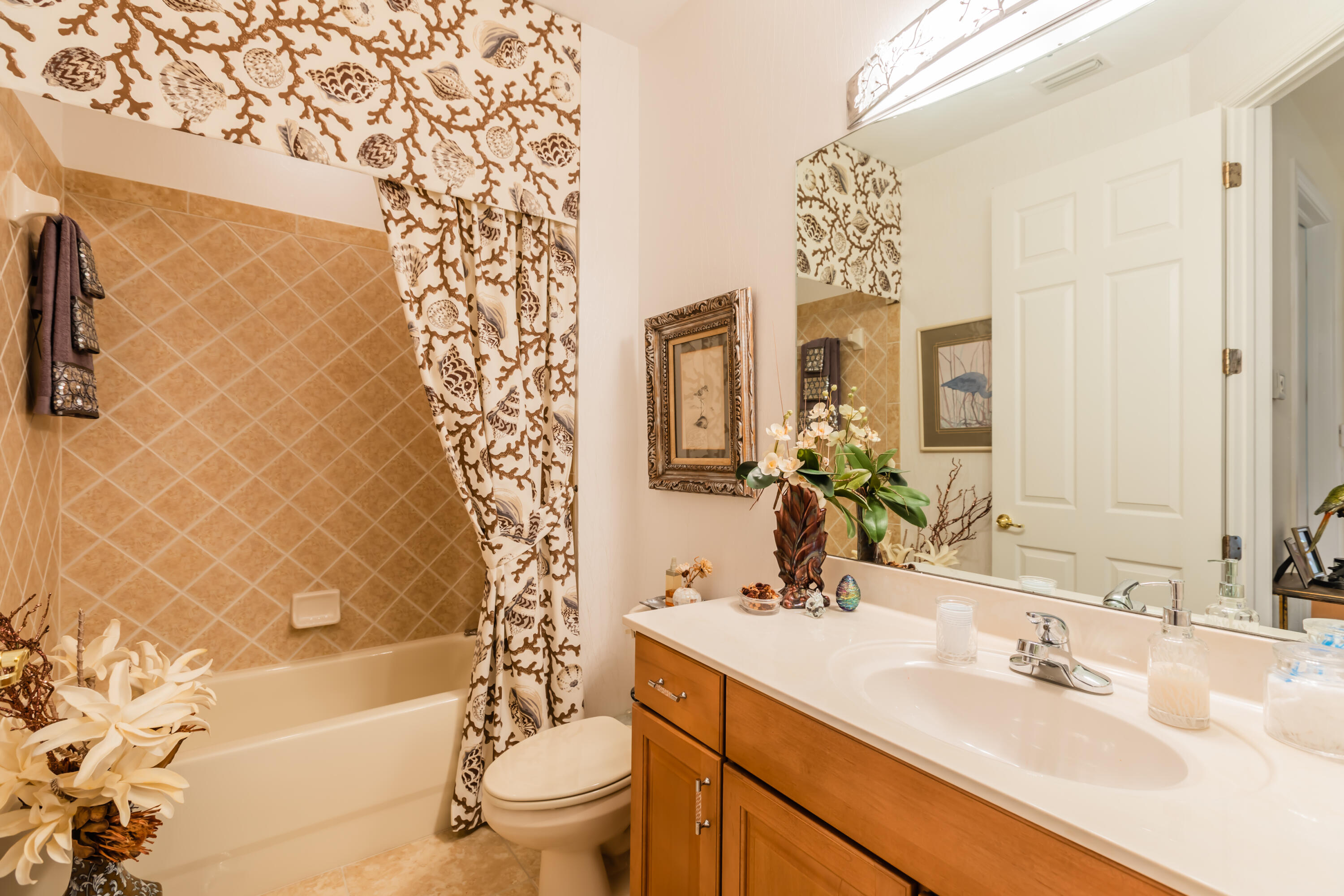 14728 Cranberry Naples Naples, FL 34114 - Photo 15 of 26 a bathroom with a sink a toilet and a bathtub