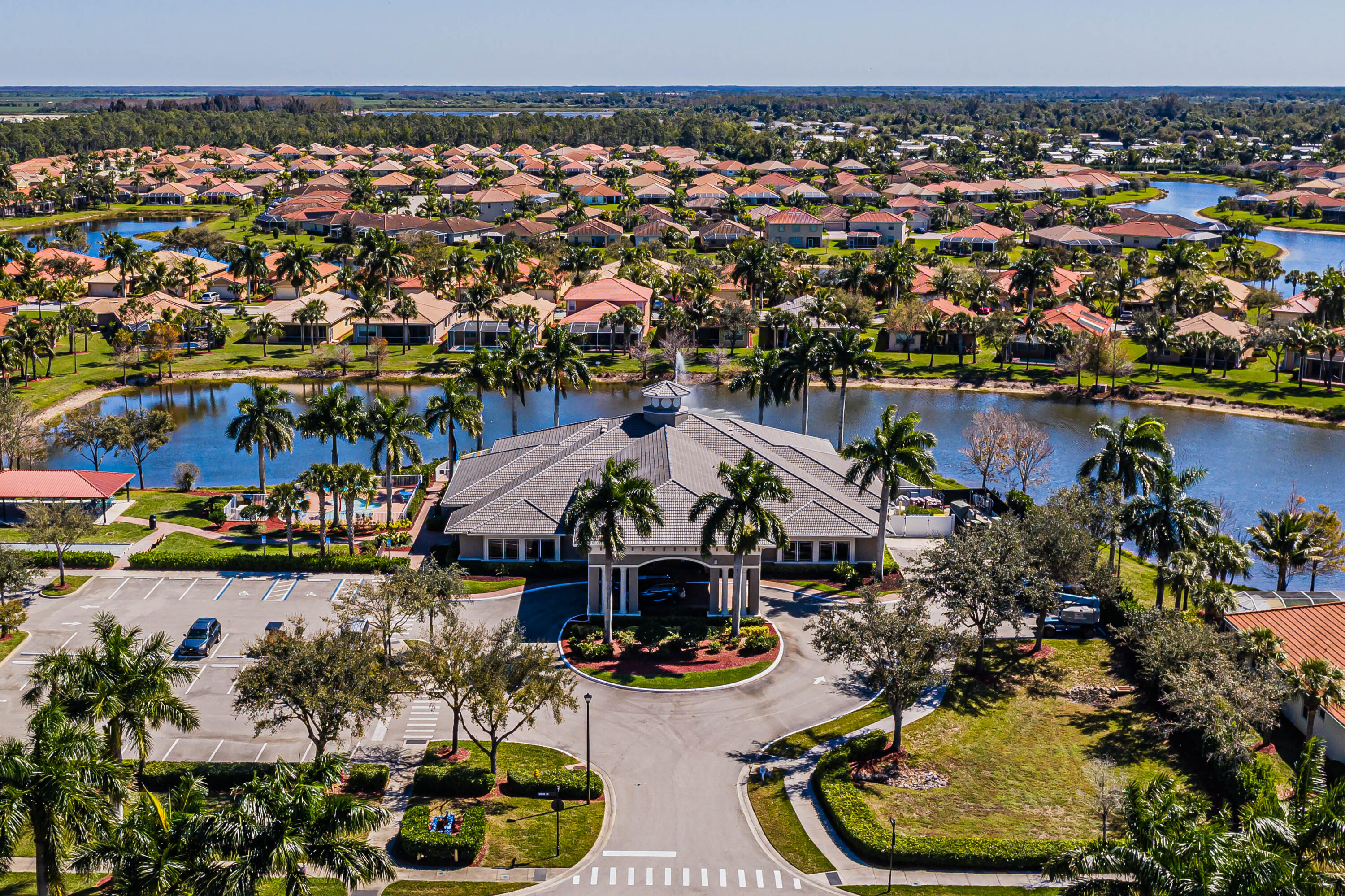 14728 Cranberry Naples Naples, FL 34114 - Photo 17 of 26 an aerial view of a house with a lake and city view