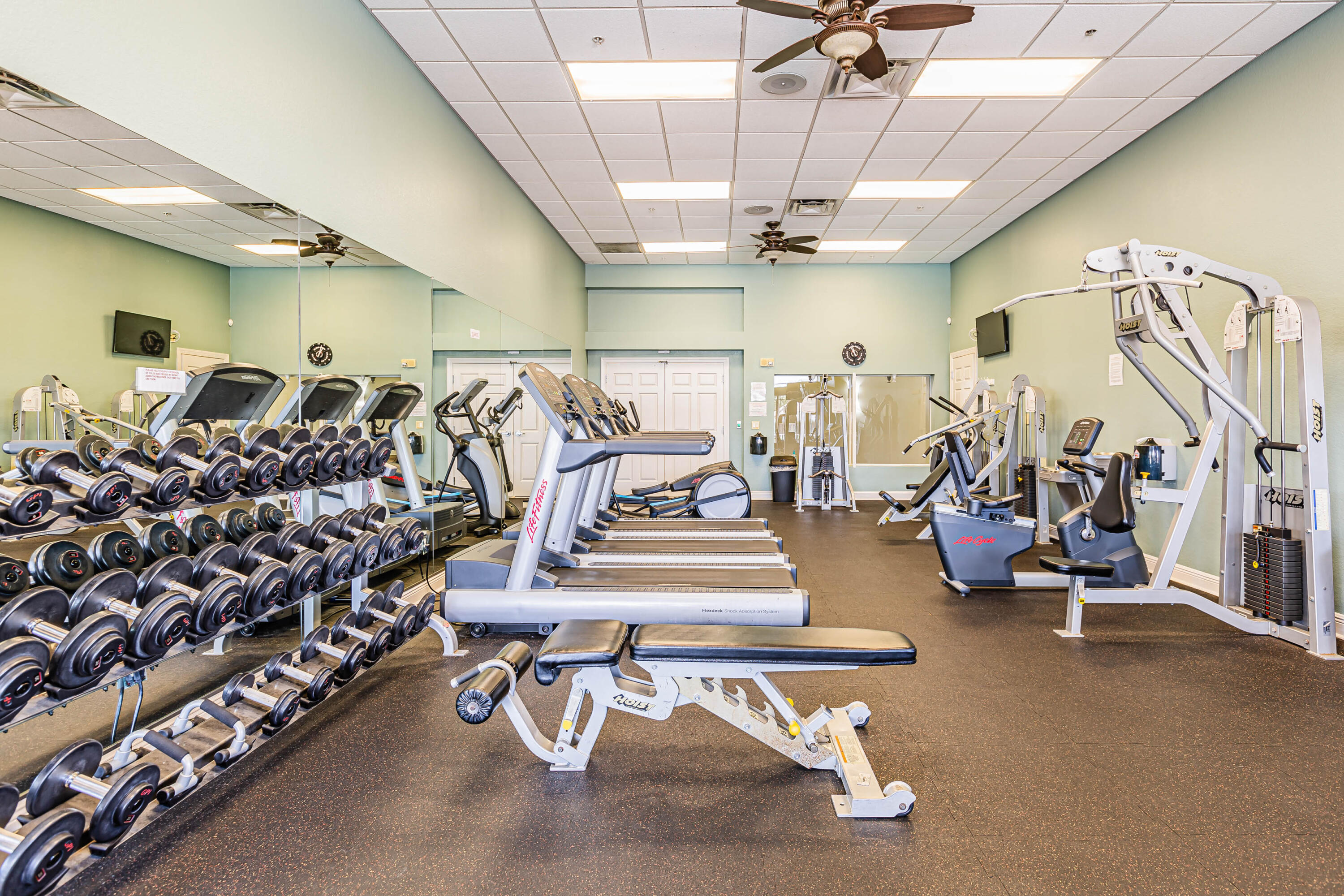 14728 Cranberry Naples Naples, FL 34114 - Photo 21 of 26 a view of a room with gym equipment