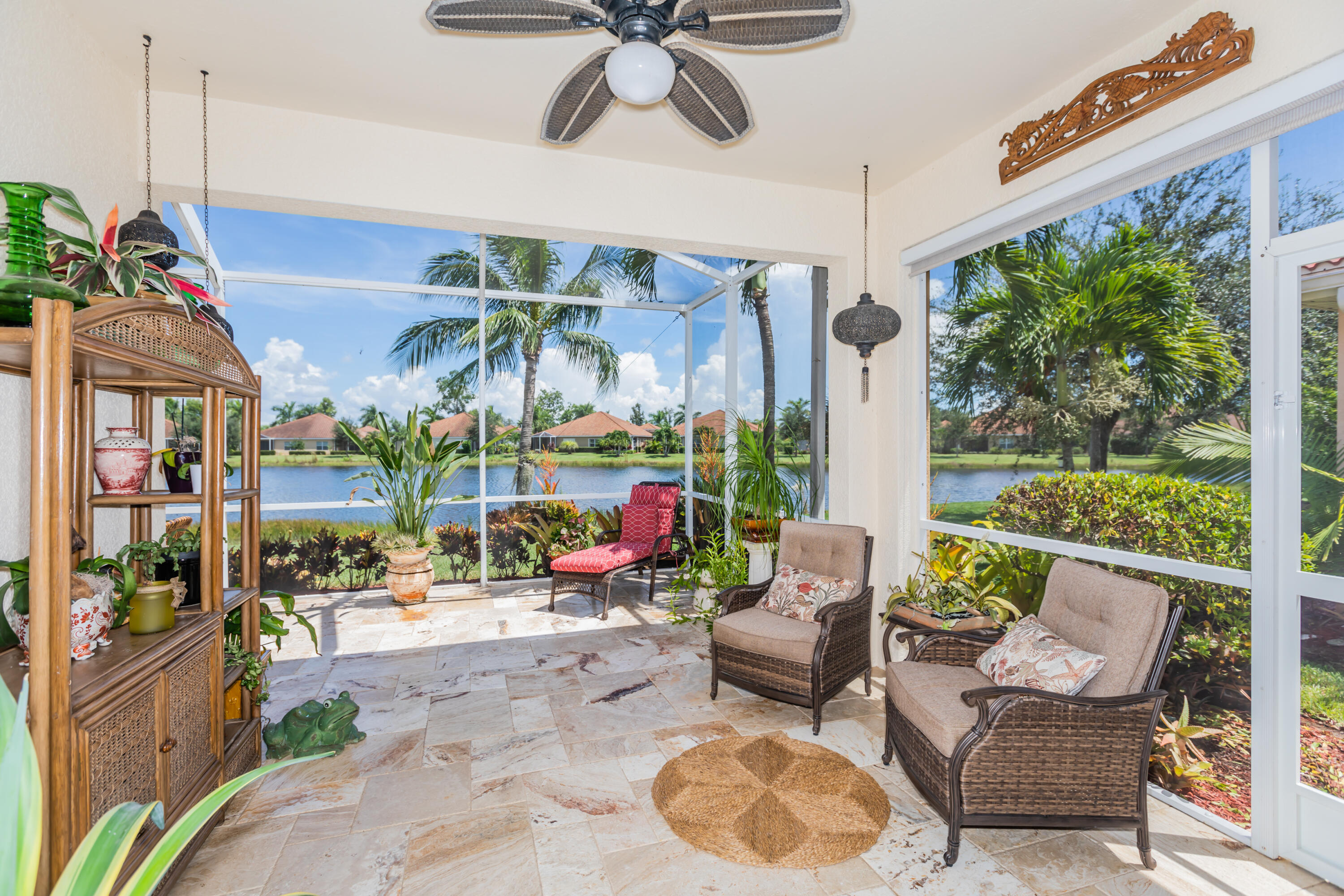 14728 Cranberry Naples Naples, FL 34114 - Photo 4 of 26 a outdoor living space with patio furniture and a potted plant