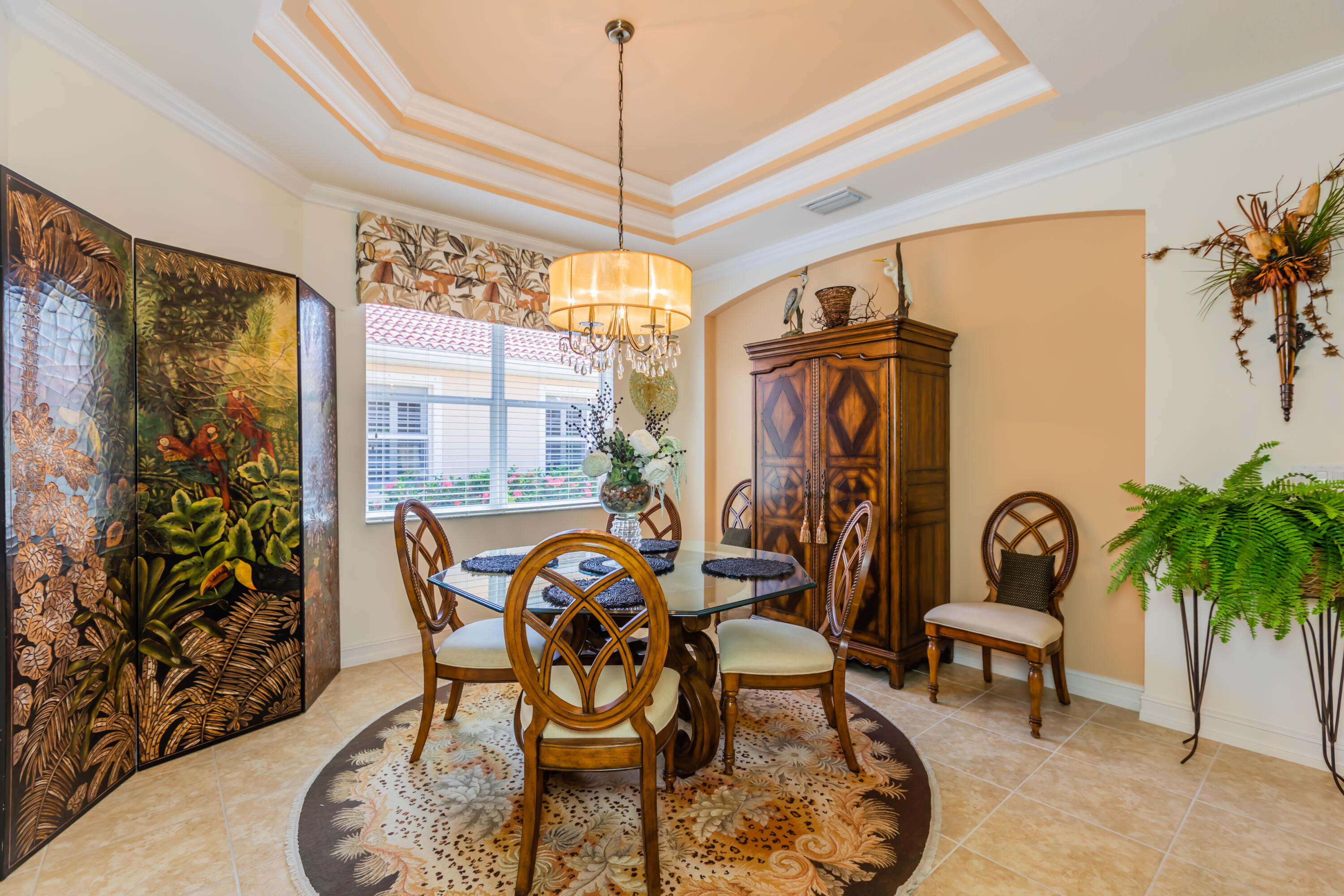 14728 Cranberry Naples Naples, FL 34114 - Photo 8 of 26 a dining room with furniture garden view and a chandelier