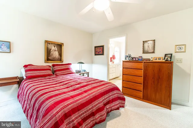 a bedroom with a bed and dresser